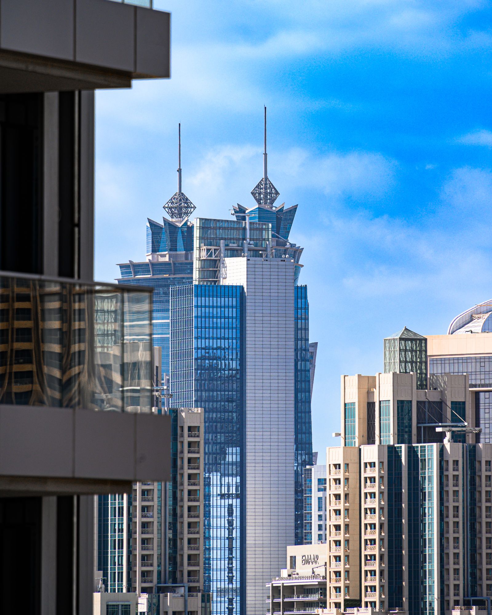 Architectural details of modern glass high-rise towers in Dubai